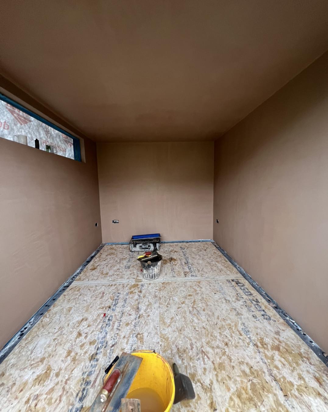 A small room plastered throughout, ready to dry