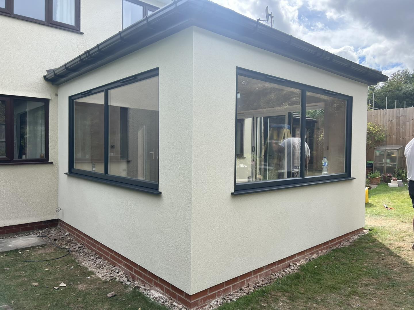 The same extension rendered in cream, with grey framed windows